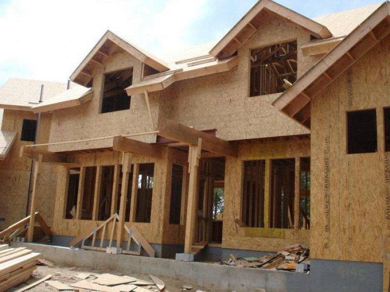 Construction worker building a wooden frame